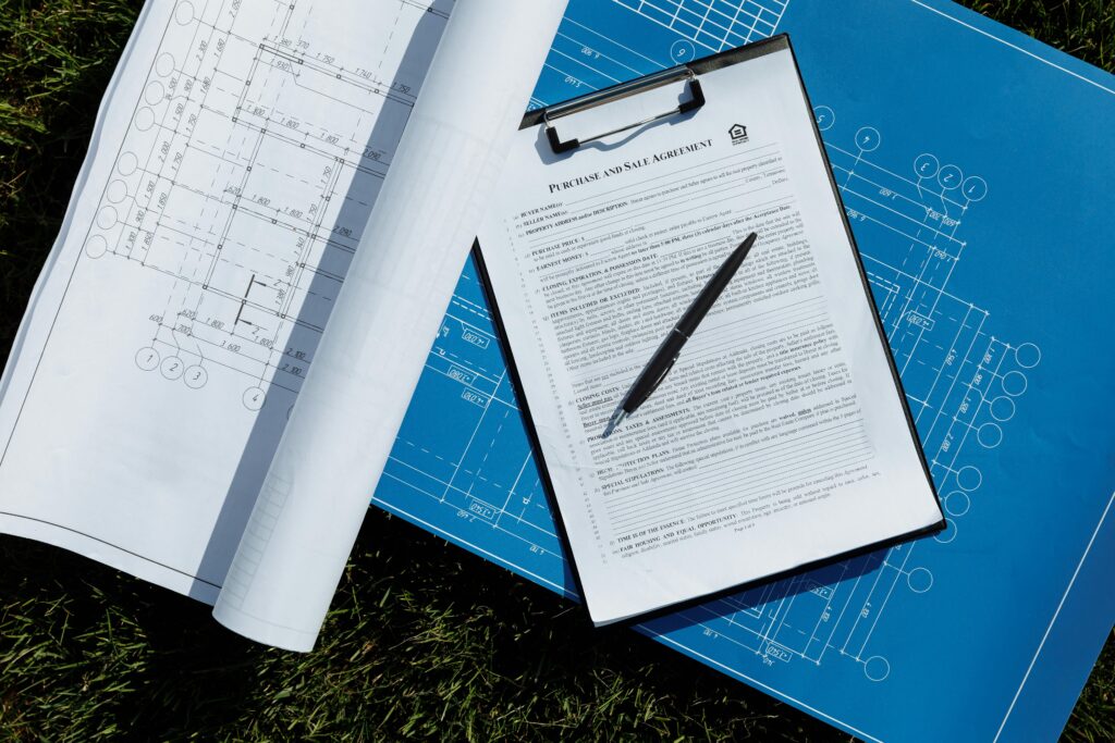 Overhead view of blueprints and construction themes Overhead view of blueprints and construction themes